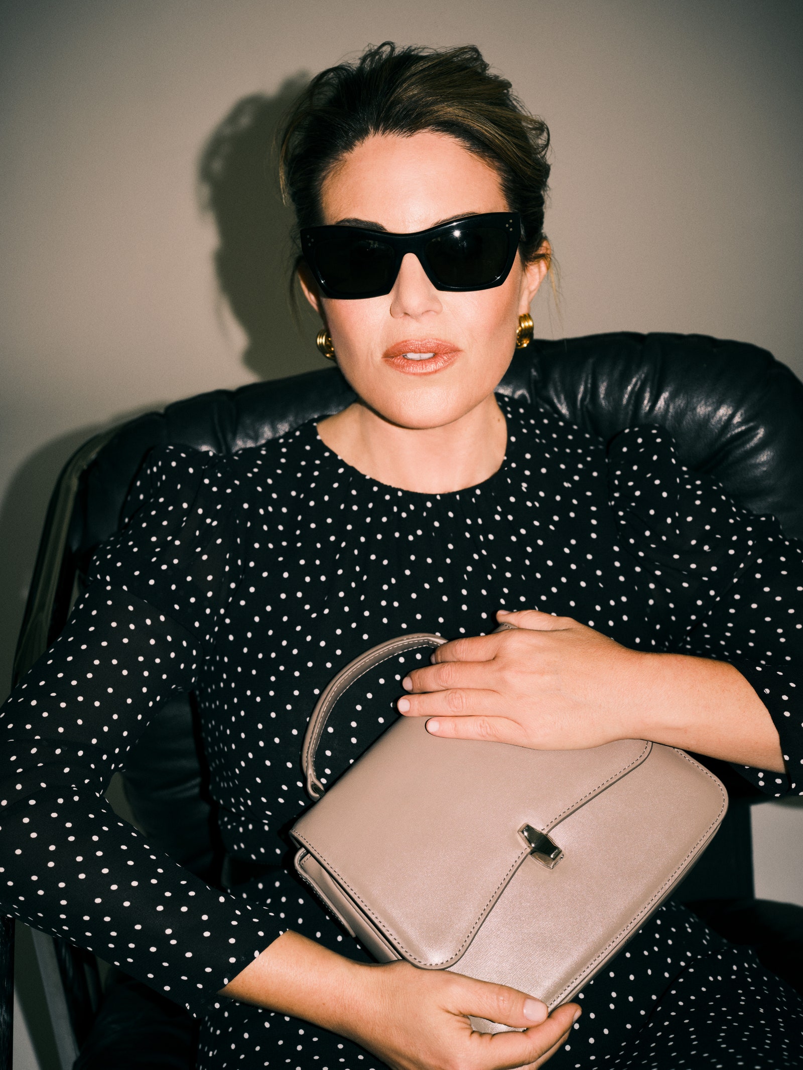 Image may contain Accessories Bag Handbag Sunglasses Purse Face Head Person Photography Portrait and Adult